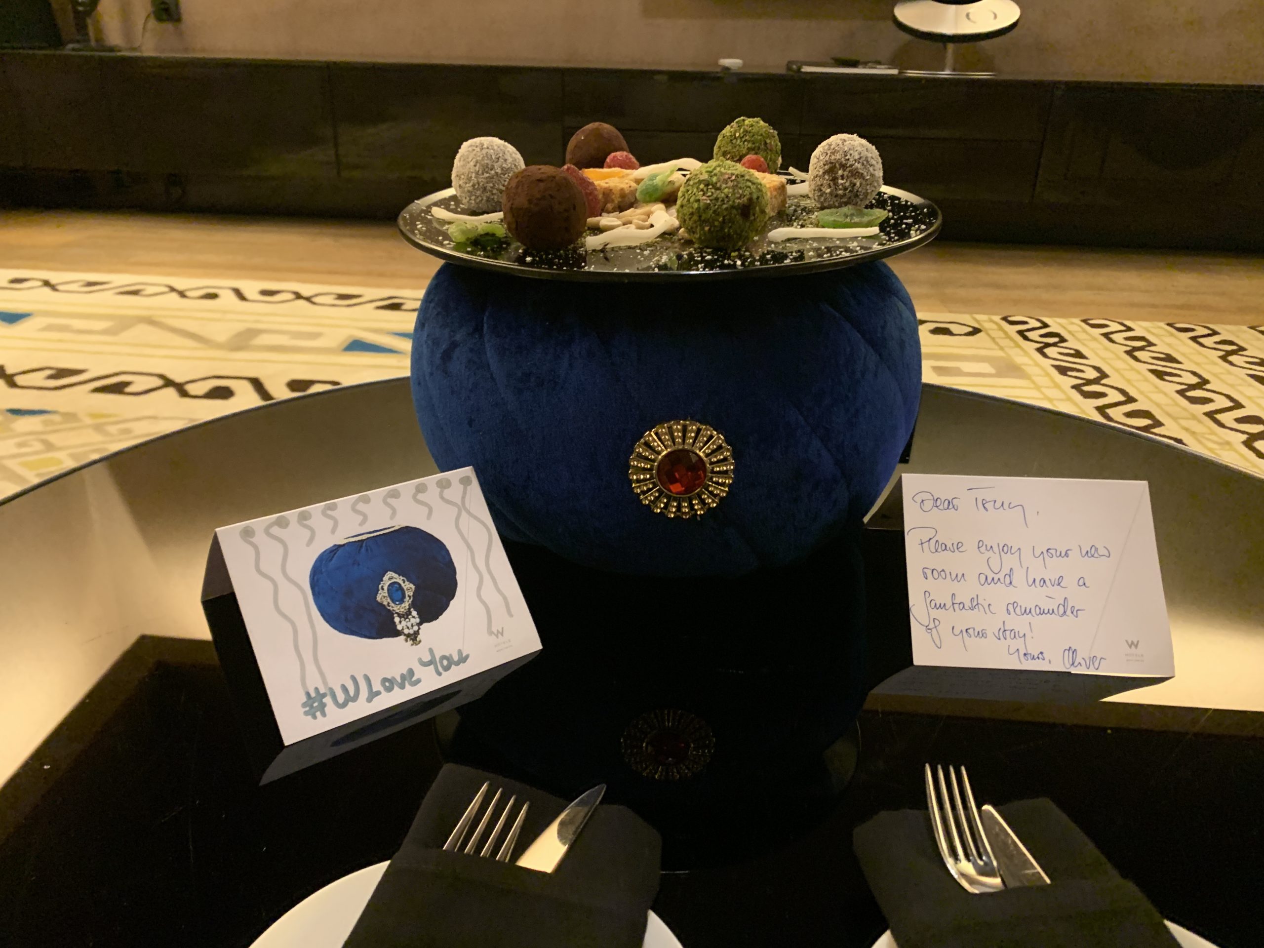 Sultan's cap welcome amenity with plant-based truffles, #WLoveYou card, and handwritten note from the GM at the W Istanbul — SPG personalized service